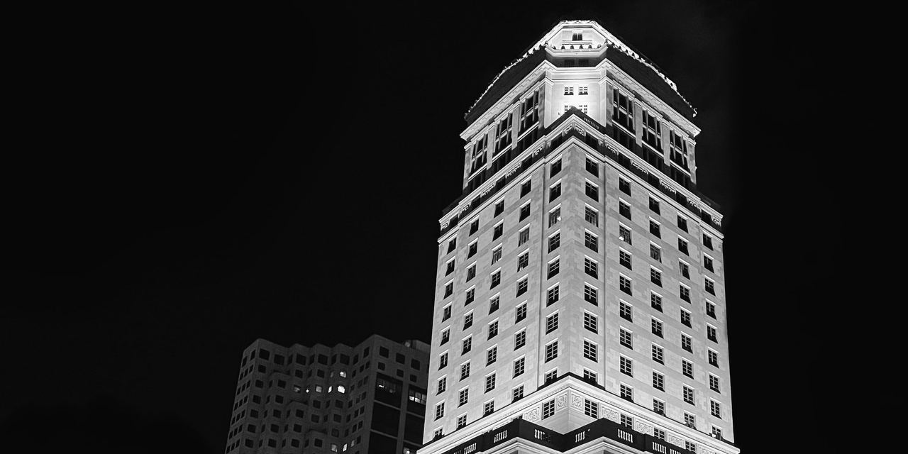 The Miami-Dade County Courthouse tower lit against the night sky